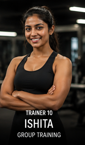 Trainer 10, Ishita, Group Training specialist, standing smiling on the gym floor.